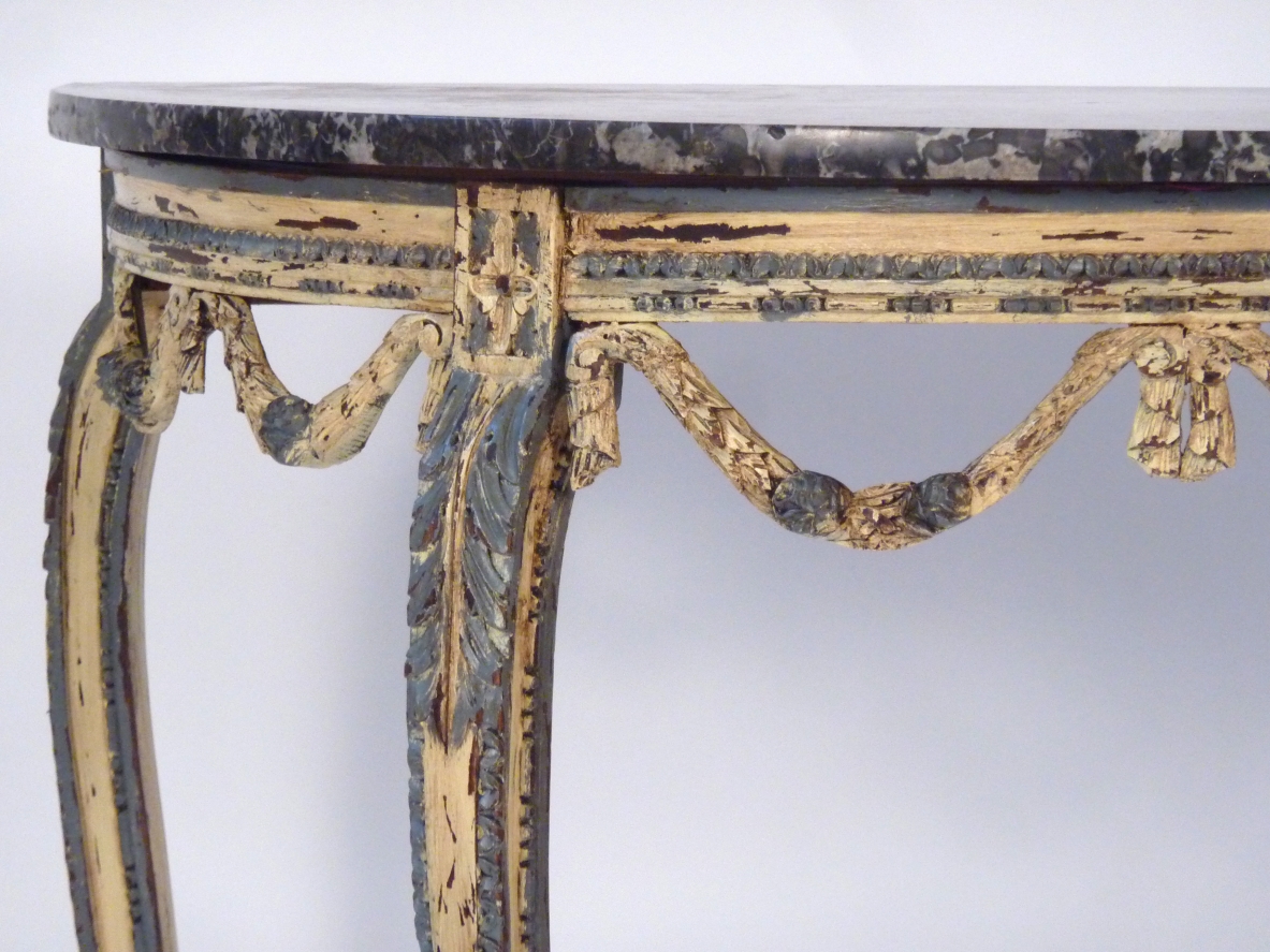 Luis XVI console table in painted thin carved wood, France 1770's.