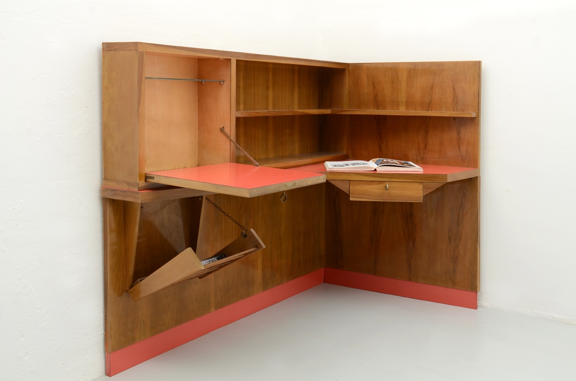 Stunning corner desk with newspaper holder, bar and shelves. Italy, 1950's.