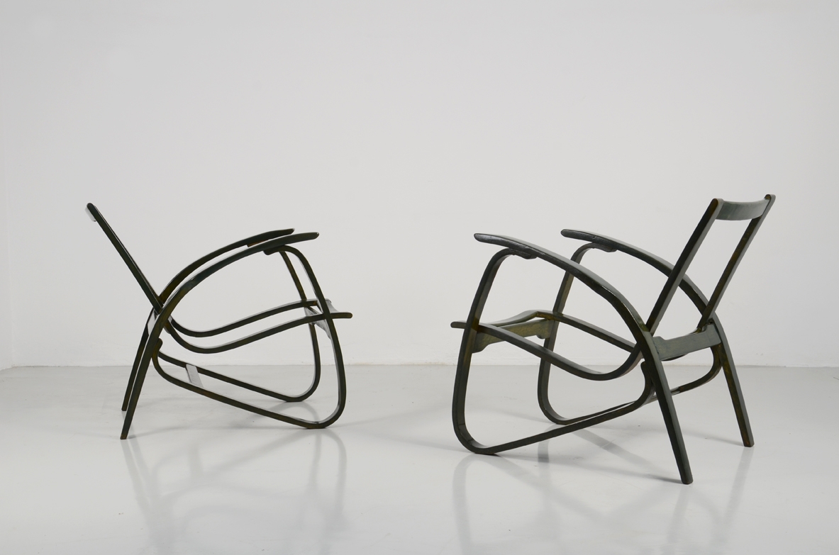 Jan Vanek, stunning pair of easy chairs in bent wood, polished with their original dark green color, Prague 1949.