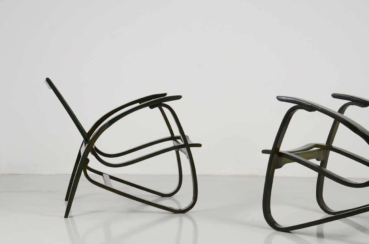 Jan Vanek, stunning pair of easy chairs in bent wood, polished with their original dark green color, Prague 1949.