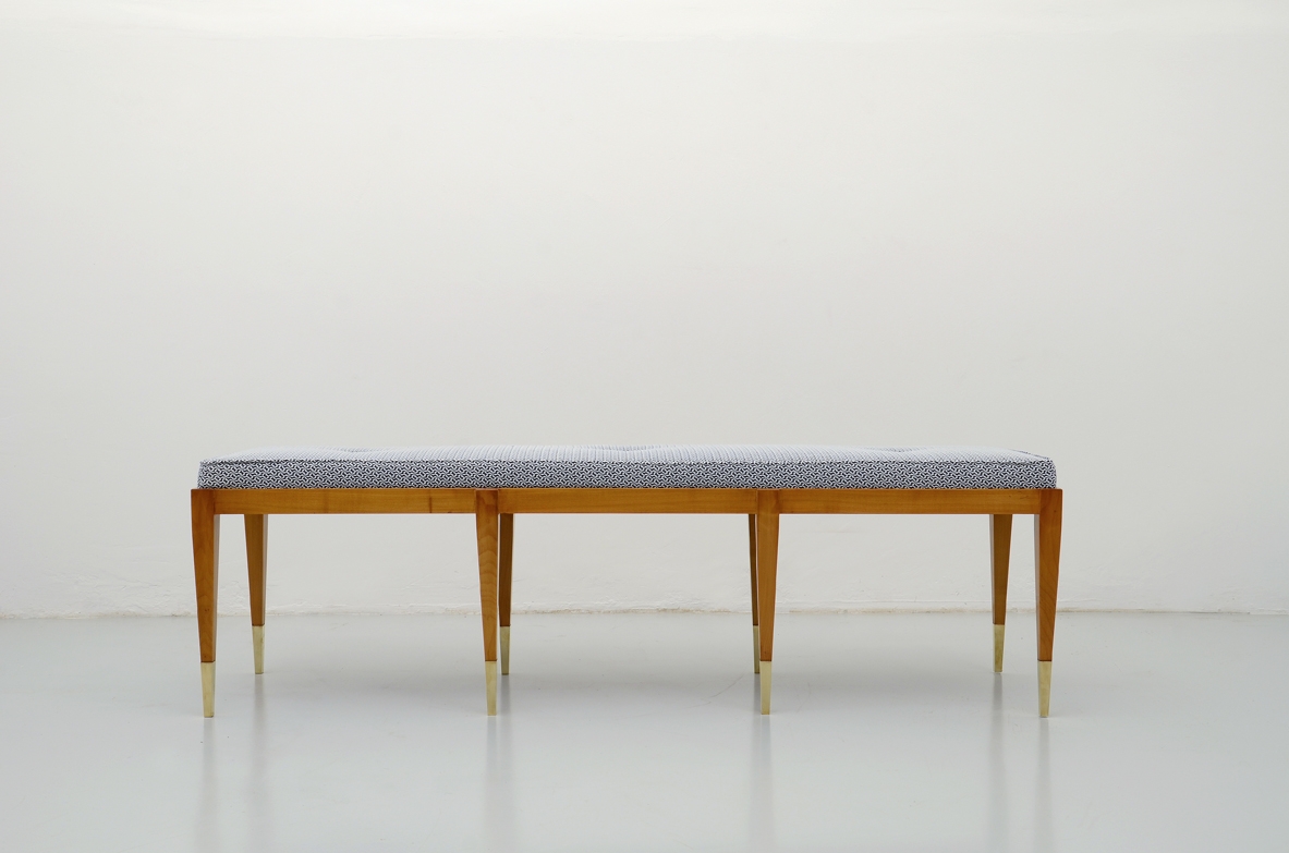 Elegant bench in cherry wood with nice and thin brass tips.