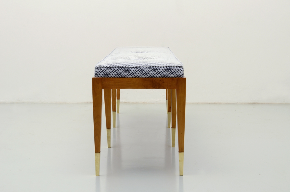 Elegant bench in cherry wood with nice and thin brass tips.
