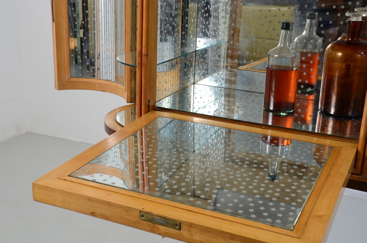 Bar cabinet based on a central column, Italy 1940's.