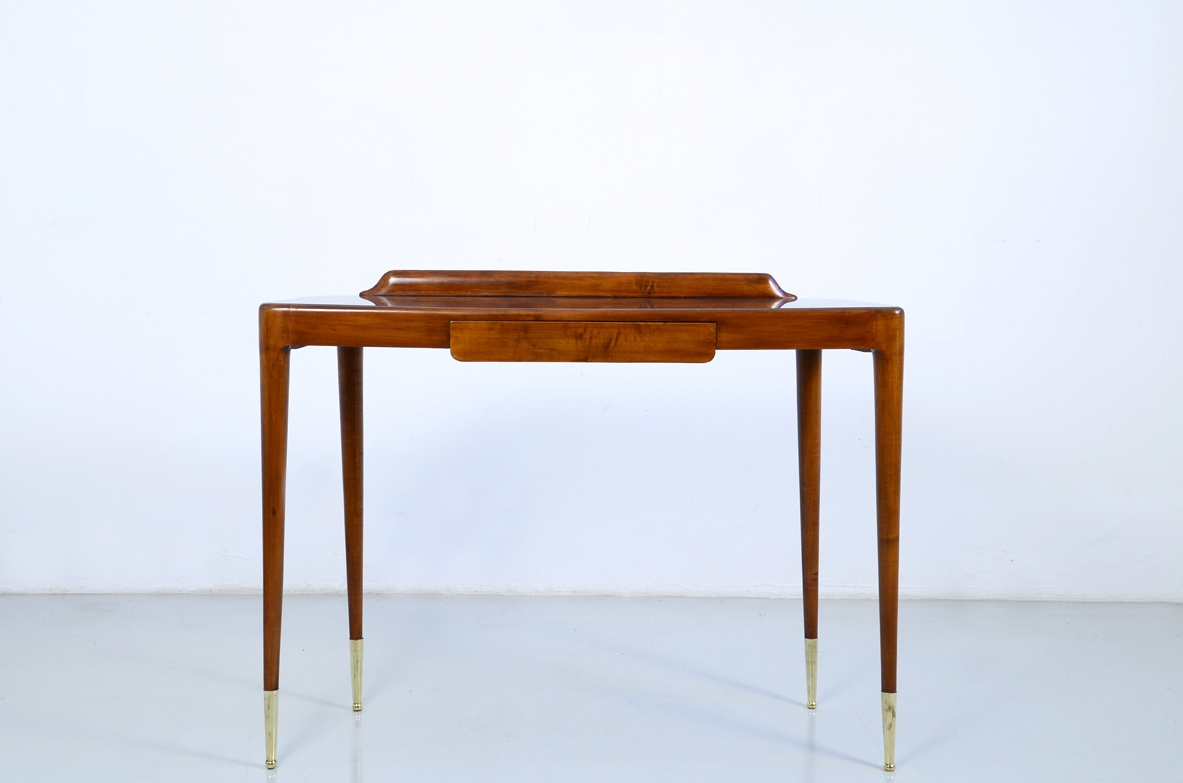 Elegant Italian 1950's console table with thin legs on long bronze tips.