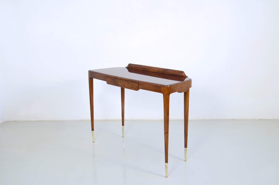 Elegant Italian 1950's console table with thin legs on long bronze tips.