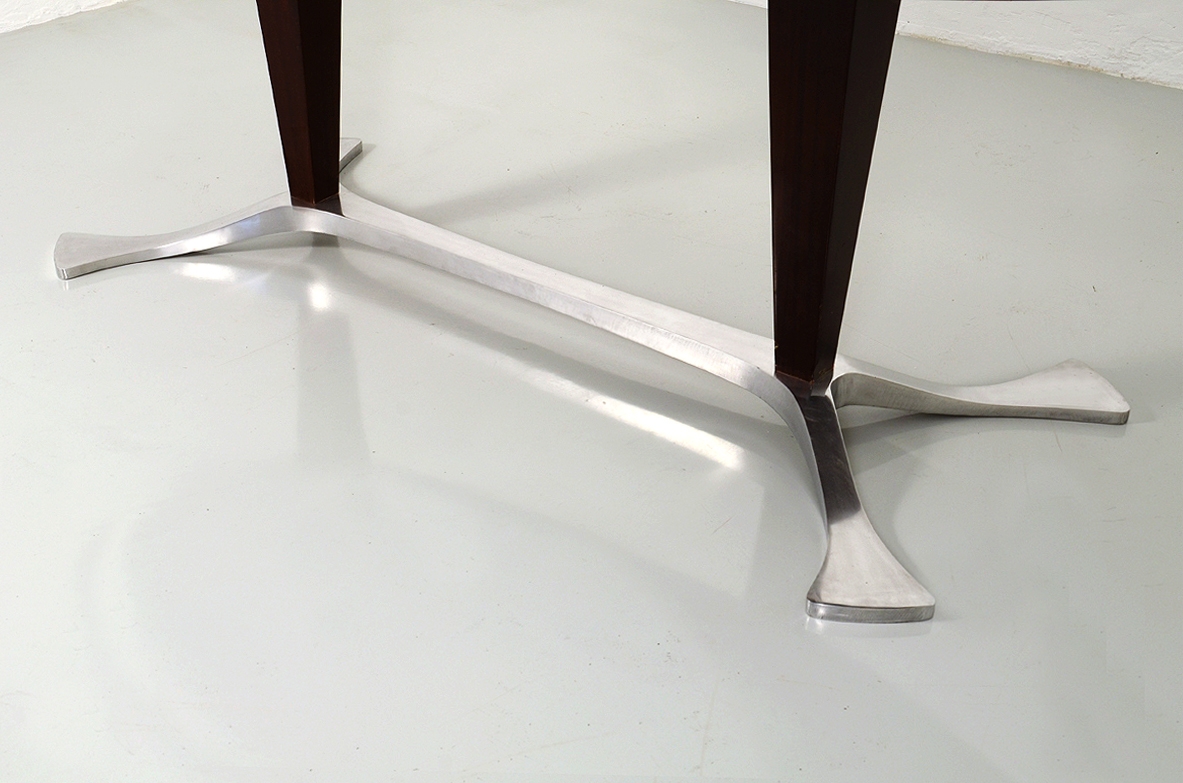 Arredamenti Borsani, oval dining table in macassar wood with a very special base in polished metalwork, late 1950's.