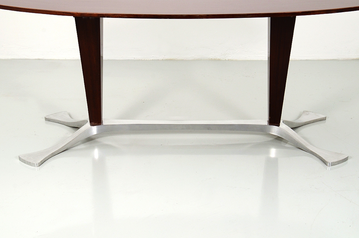 Arredamenti Borsani, oval dining table in macassar wood with a very special base in polished metalwork, late 1950's.