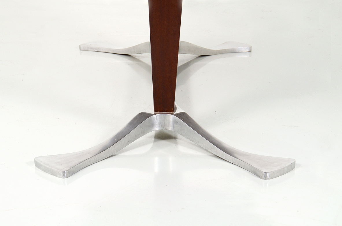Arredamenti Borsani, oval dining table in macassar wood with a very special base in polished metalwork, late 1950's.
