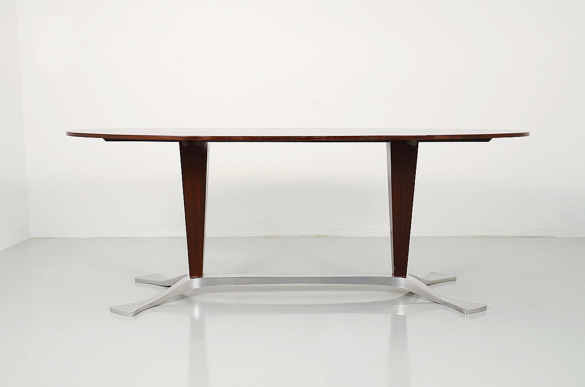 Arredamenti Borsani, oval dining table in macassar wood with a very special base in polished metalwork, late 1950's.