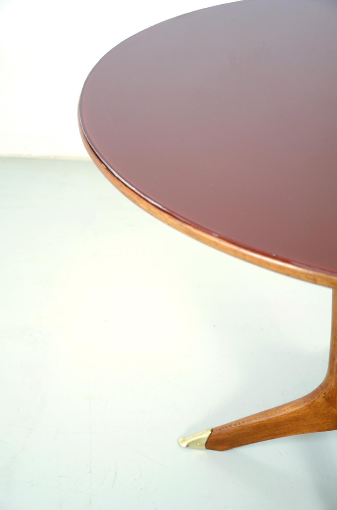 Italian 1950's round dining table with nice crossed legs and opaline glass top.