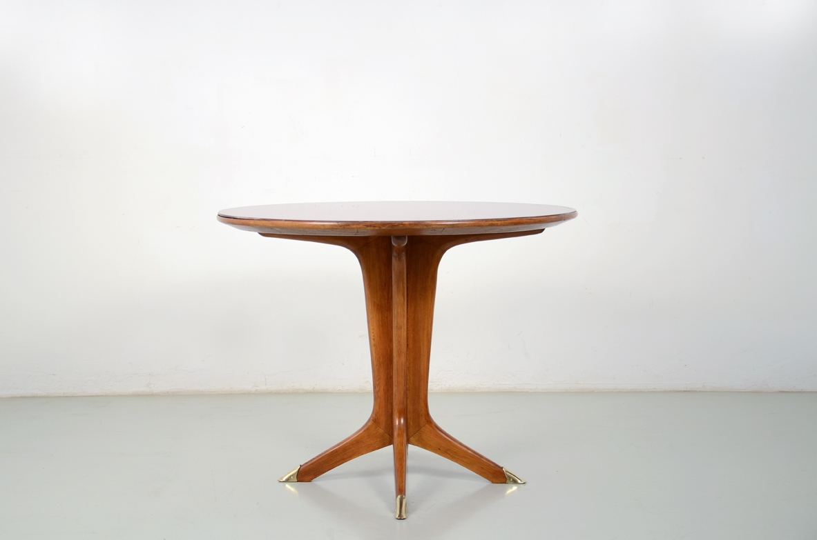Italian 1950's round dining table with nice crossed legs and opaline glass top.