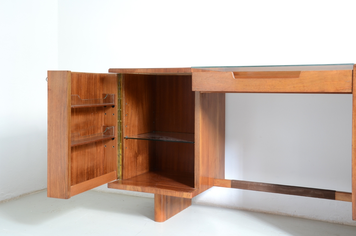 Italian 1950's sideboard in light walnut with five drawers, a nice desk and a bar cabinet.