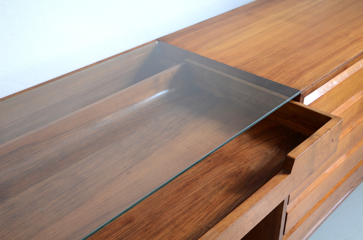 Italian 1950's sideboard in light walnut with five drawers, a nice desk and a bar cabinet.
