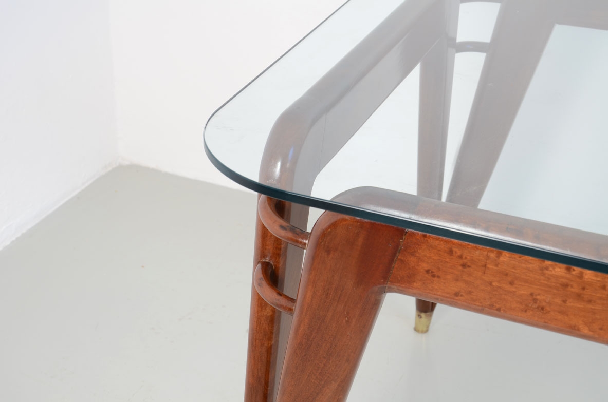 Splendid Italian 1950's dining table in mahogany with bronze tips and Crystal glass top.