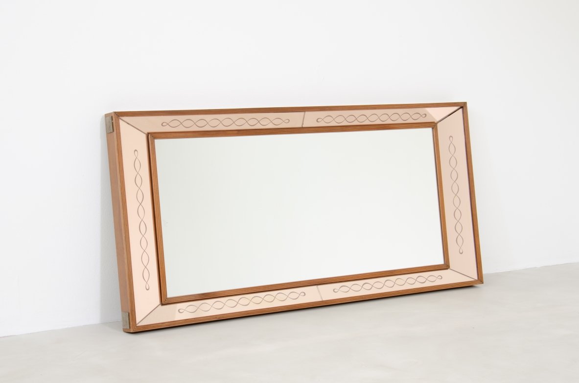 Splendid Italian 1940's mirror in a light powder color with nice serpentine ingravings.