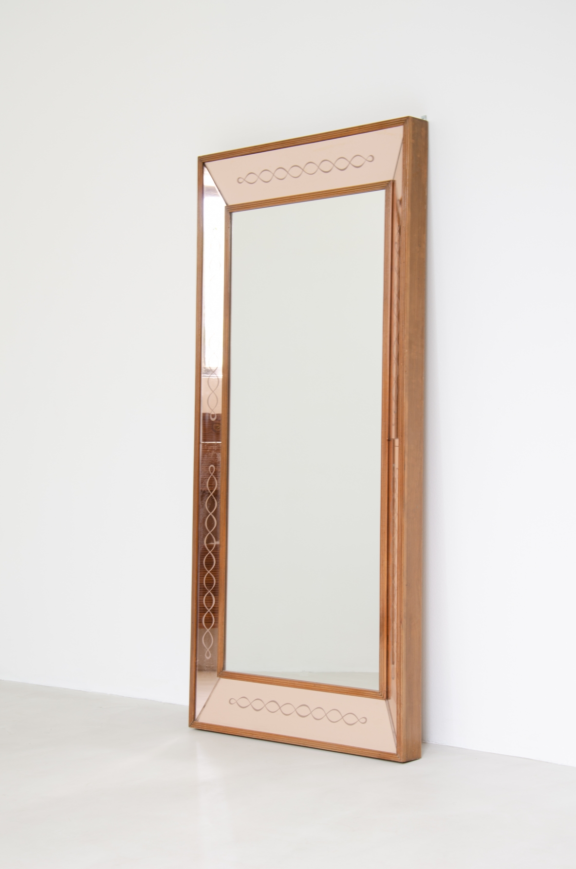 Splendid Italian 1940's mirror in a light powder color with nice serpentine ingravings.