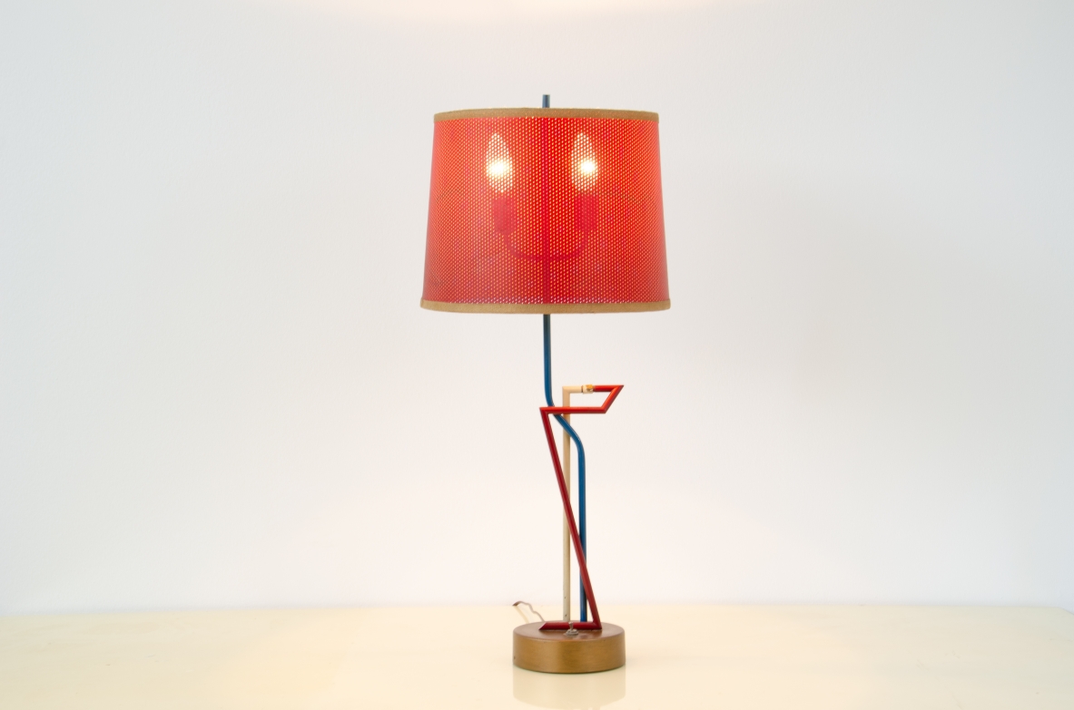 Extraordinary table lamp with brass base and two-colored very original metal stems. Beautiful original perforated paper hat in good condition.  Turin School 1950's.