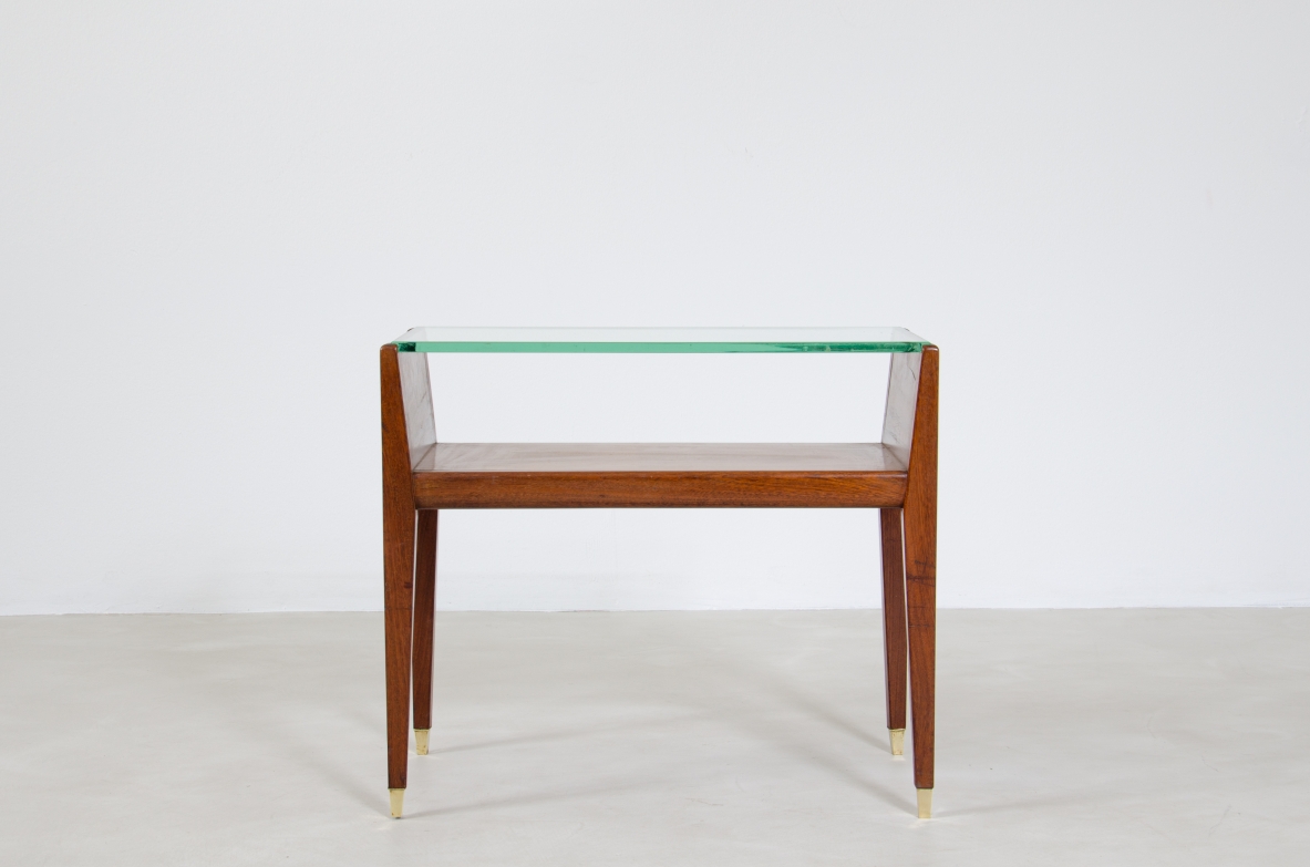 Pair of wooden bedside tables with glass top and brass tips. Italian manufacture, 1950's.