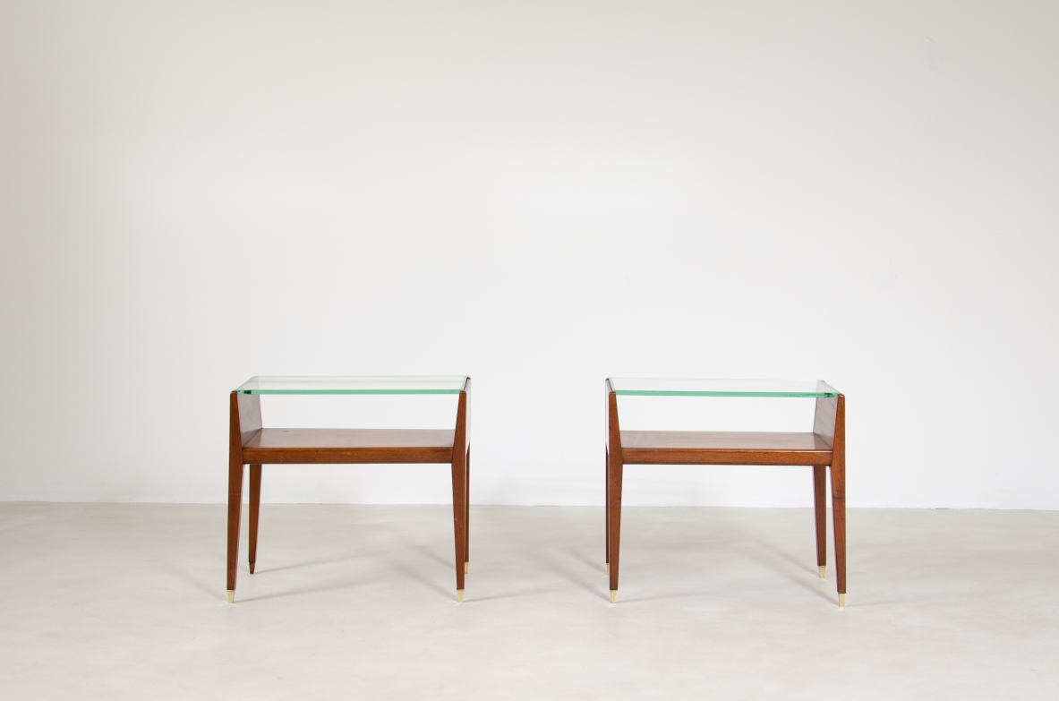 Pair of wooden bedside tables with glass top and brass tips. Italian manufacture, 1950's.