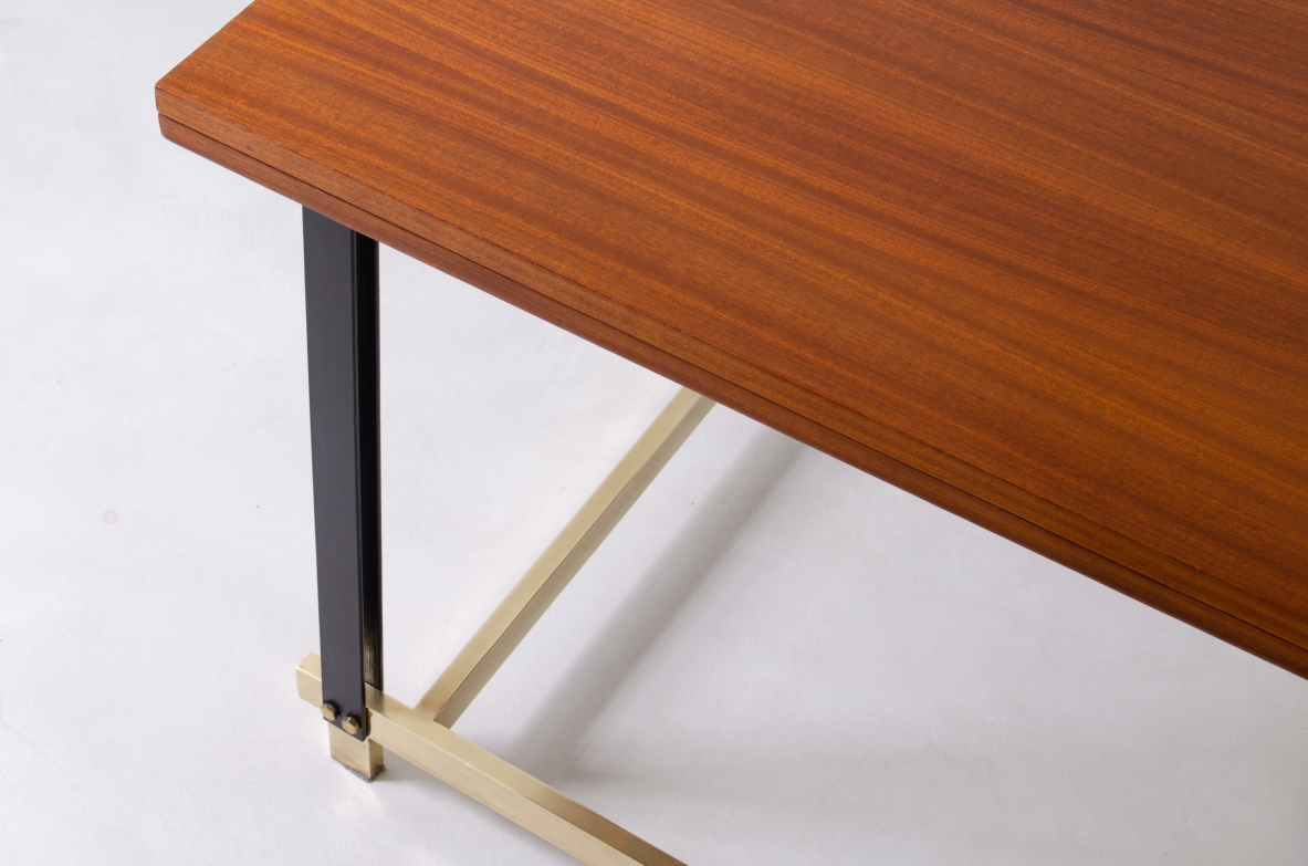 1960s extendable mahogany table with metal and brass structure.