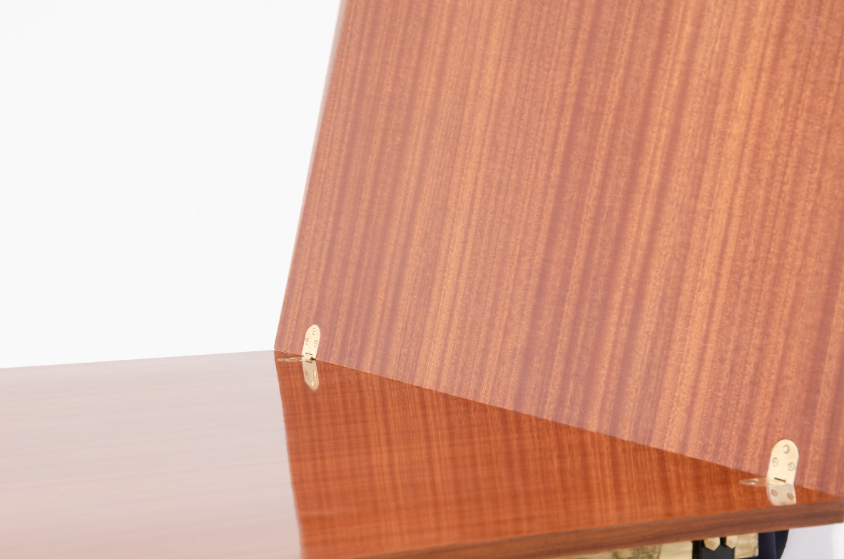 1960s extendable mahogany table with metal and brass structure.