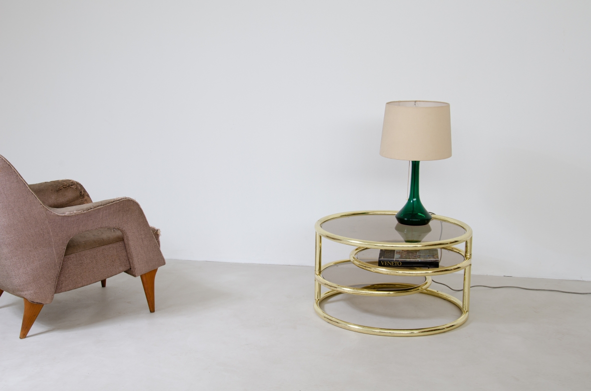 Coffee table in brass with rotating elements and original glass top. Italy 1970's.