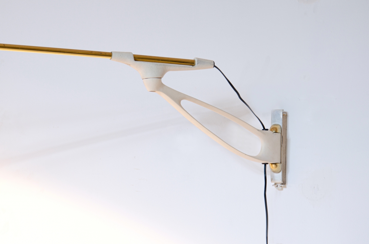Wall lamp with adjustable arm and extendable stick.  Painted metal and brass, France 1950s.