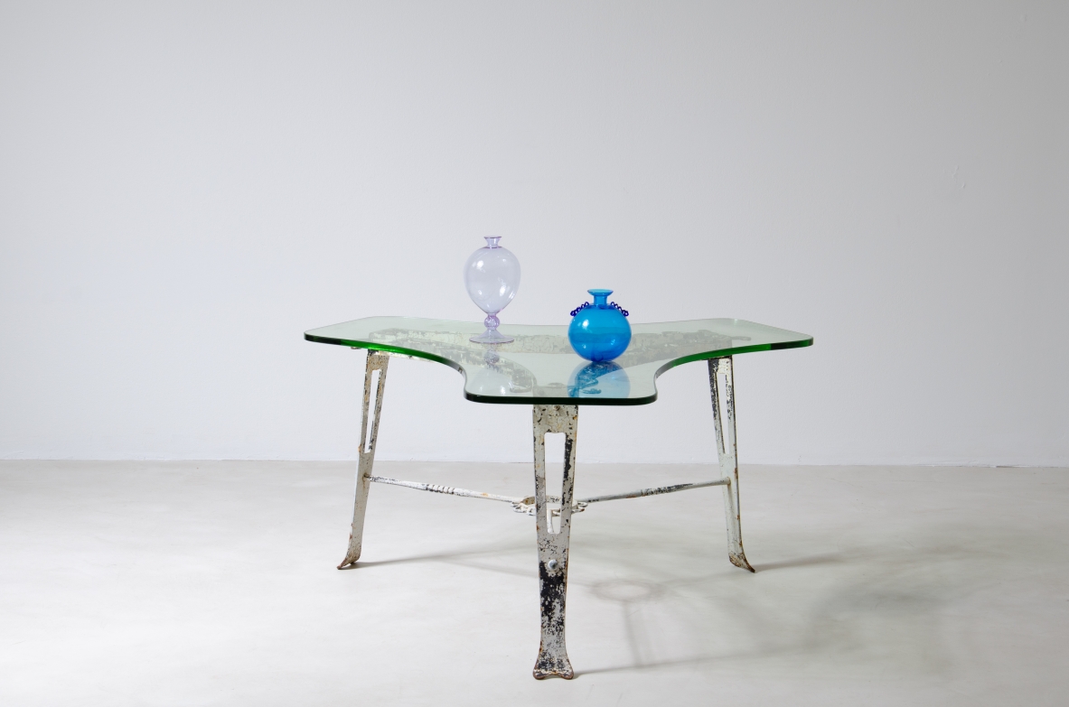Luigi Brusotti (1877-1959)  Low table in wrought iron with thick shaped glass top.  Milan, 1950s.