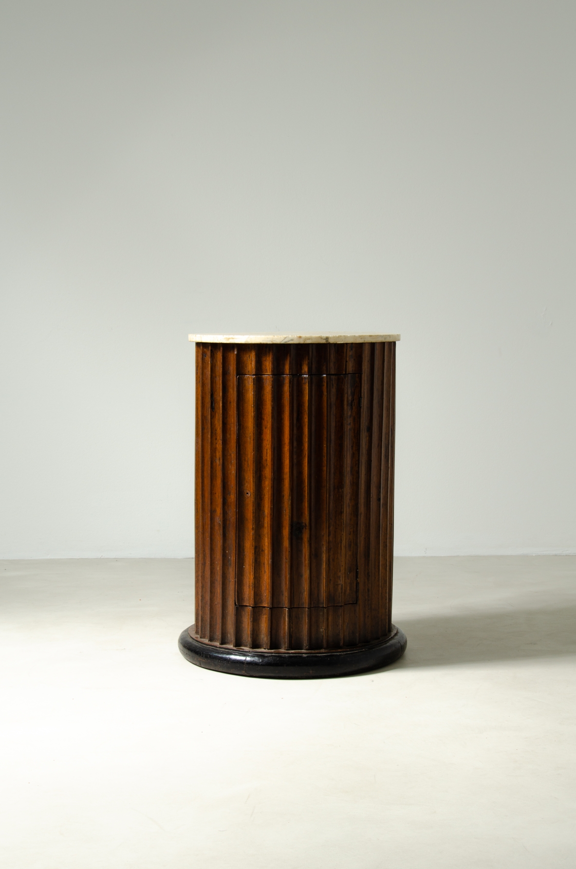 Column in fluted walnut with door and top in marble.  Italian manufacture, late Empire period, around 1830s.