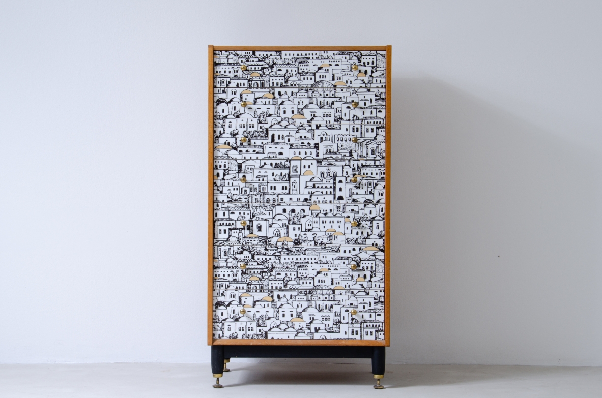 Piero Fornasetti, small cabinet with drawers with front decorated with Middle Eastern architectural patterns. Wooden base with brass tips and ash sides.  Signed Piero Fornasetti, 1950's.