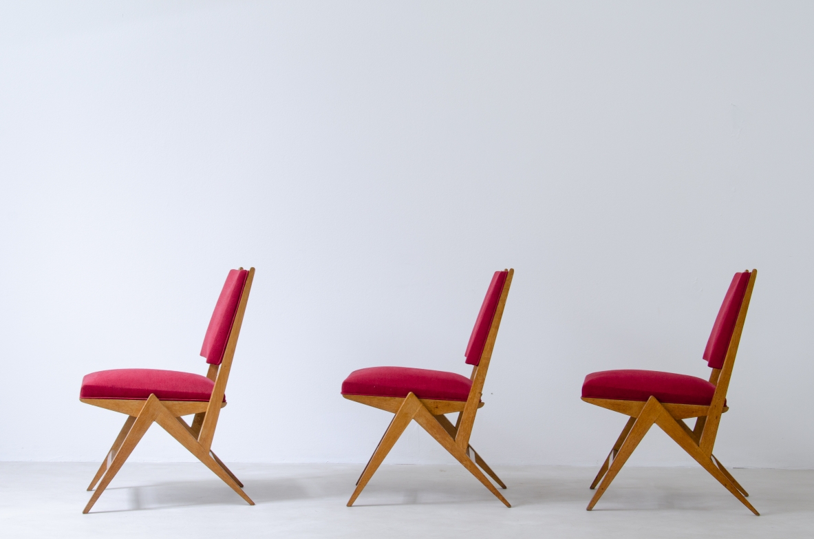 Set of six chairs in Oak with red fabric upholstery, France, 1950's.