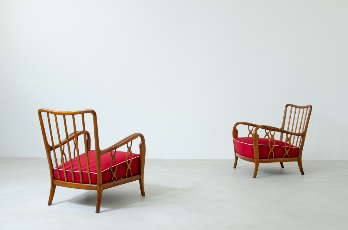 Pair of cherry wood armchairs with ribbon motif on the sides. Seat and back in padded fabric.  Attribution Paolo Buffa 1930s.
