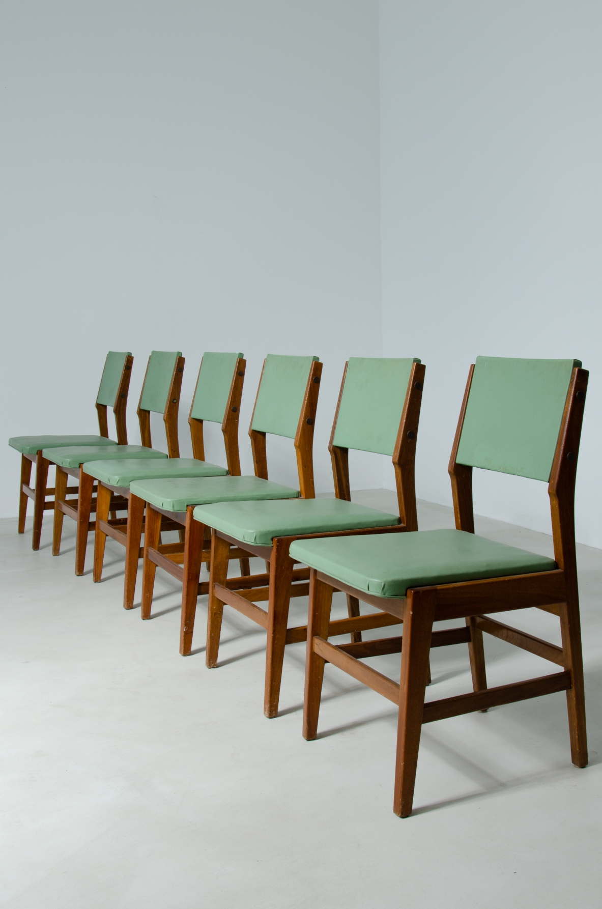 Six chairs with wooden structure and seat and back in padded fabric.  Attribution Gio Ponti 1950s.