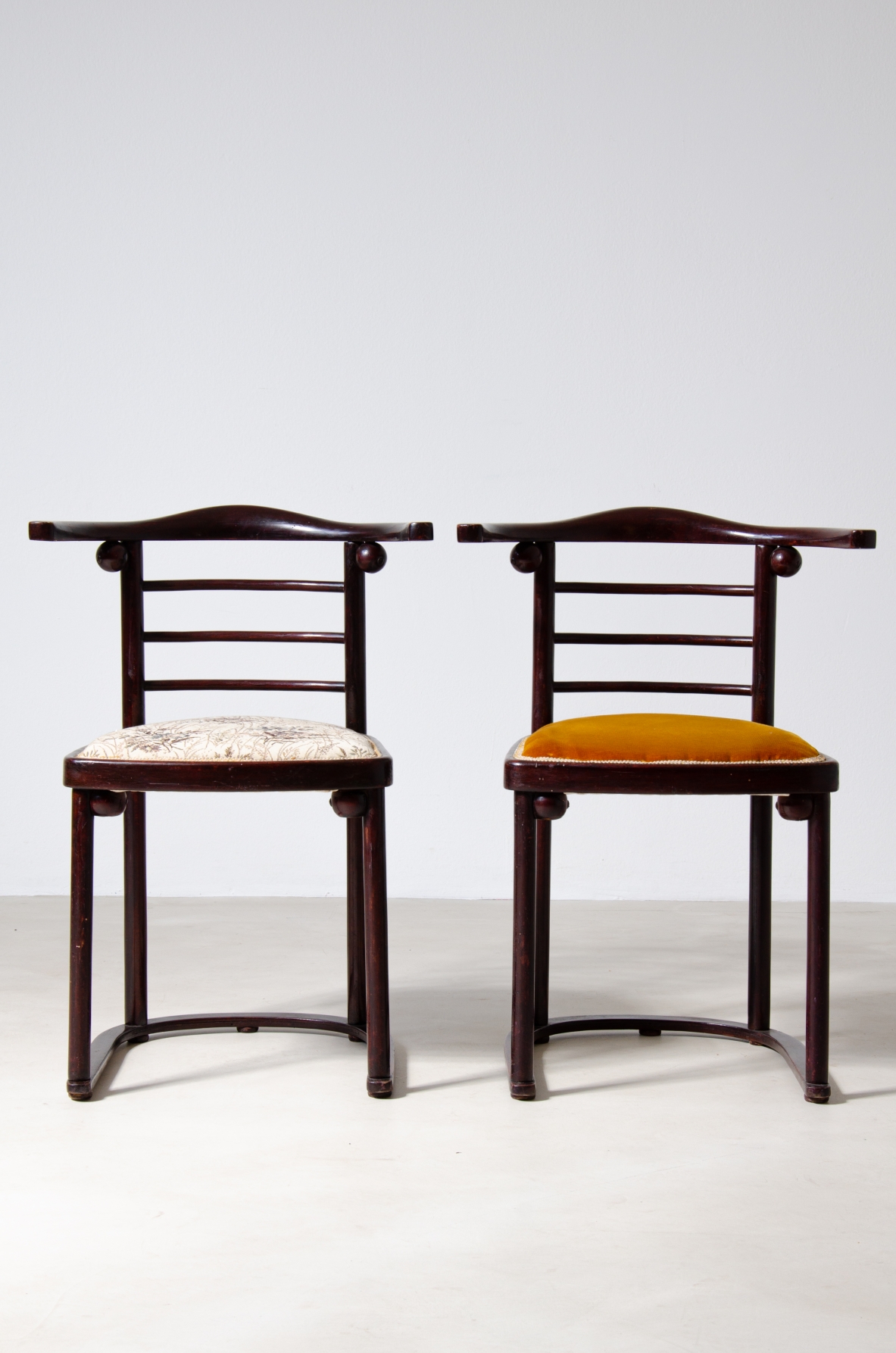 Josef Hoffmann (1870-1956)  Rare set of four chairs in curved polished wood and upholstered seat.  Manufactured by JJ.Kohn, Vienna, 1907.