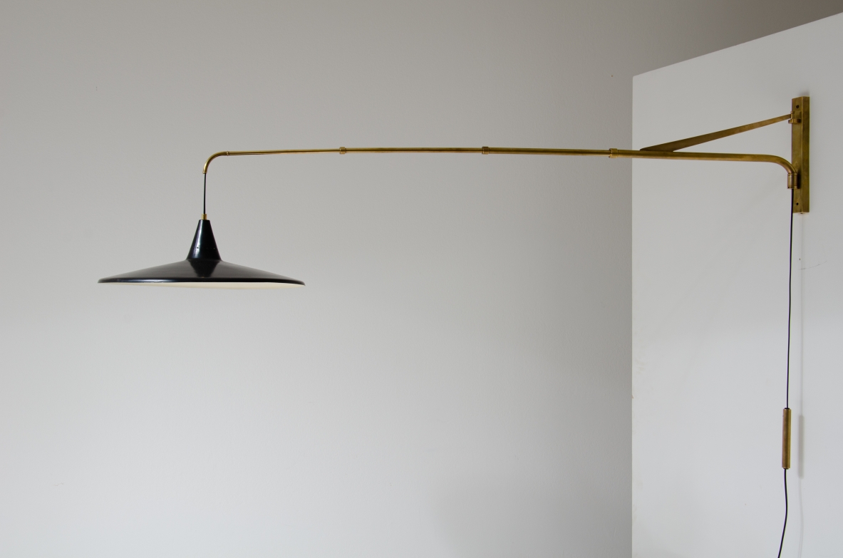 Extensible lamp with with brass stem and black painted metal shade.  Italian manufacture, 1950s.