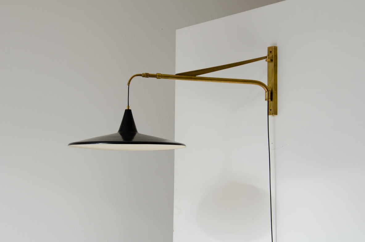 Extensible lamp with with brass stem and black painted metal shade.  Italian manufacture, 1950s.