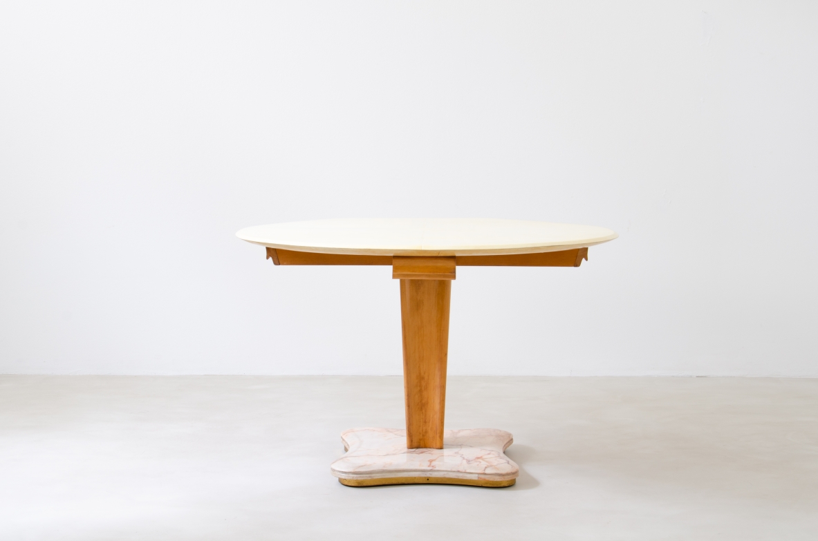 Rare Italian 1950's round table with parchment top, four drawers and marble base.