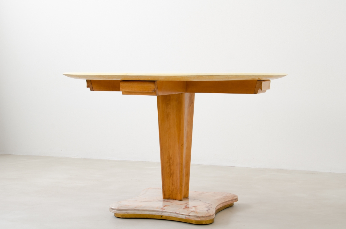 Rare Italian 1950's round table with parchment top, four drawers and marble base.