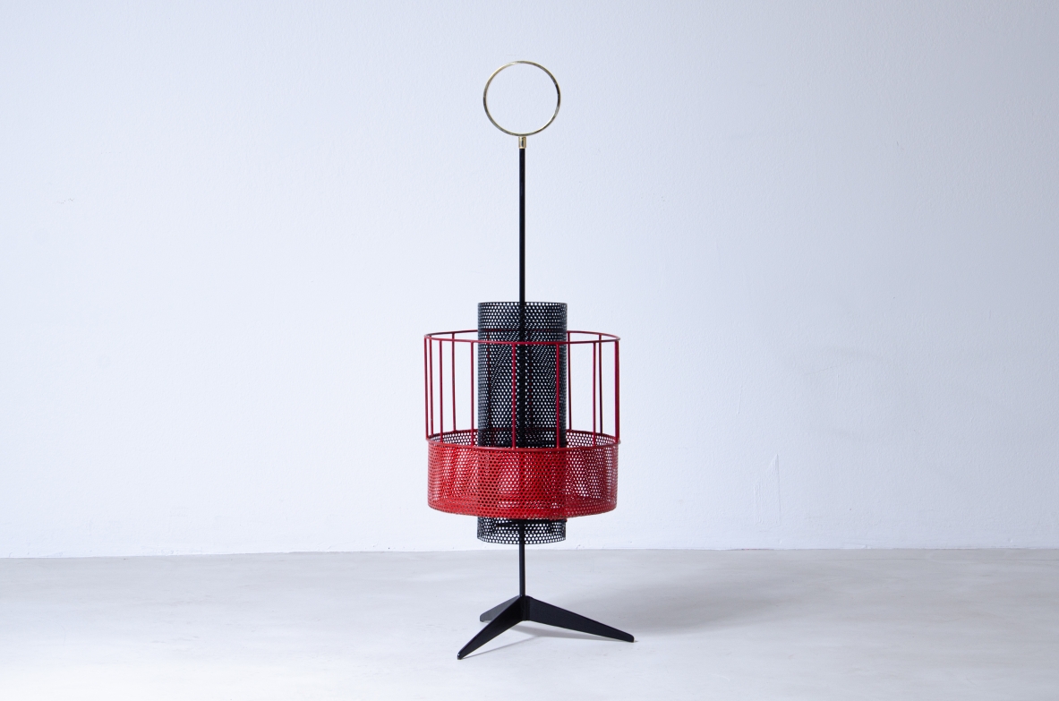 Mathieu Matègot, perforated and colored metal magazine rack or bottle holder with enamelled iron handle and foot.  French 1950s manufacture.