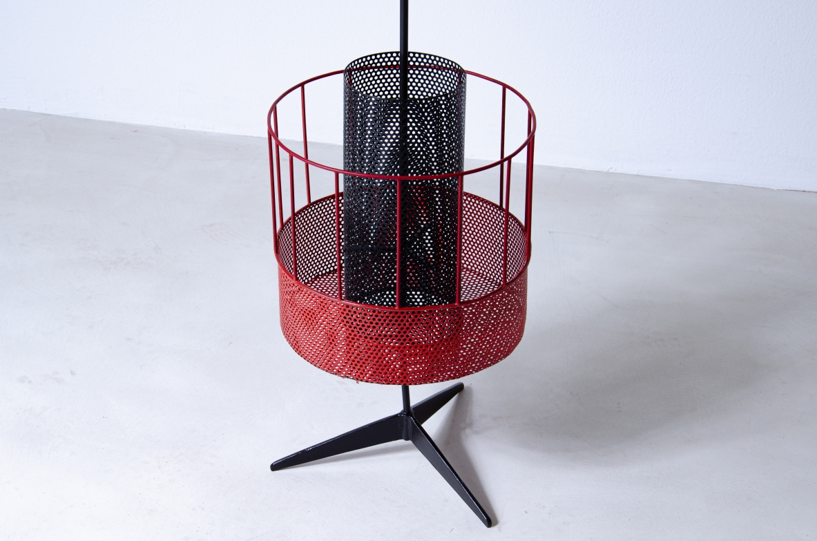 Mathieu Matègot, perforated and colored metal magazine rack or bottle holder with enamelled iron handle and foot.  French 1950s manufacture.