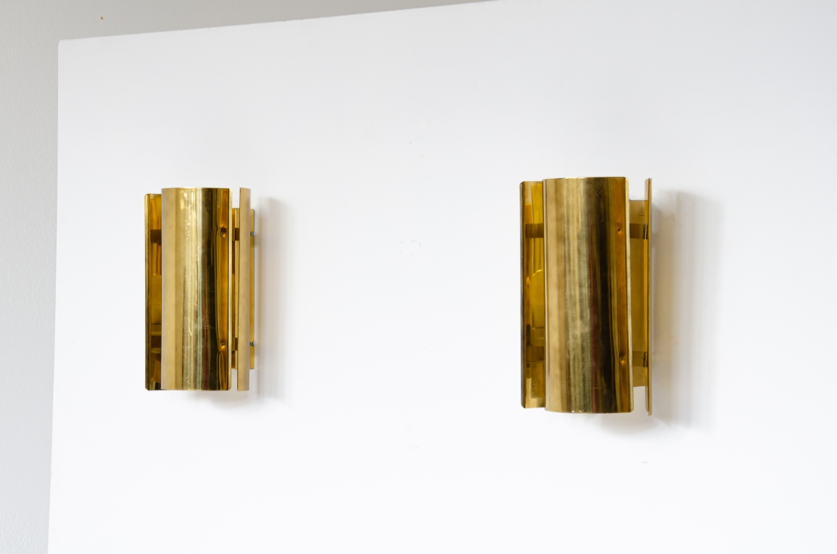 Pair of sconce wall lights in curved brass.  Prod. Falkenbergs, Sweden 1960's.