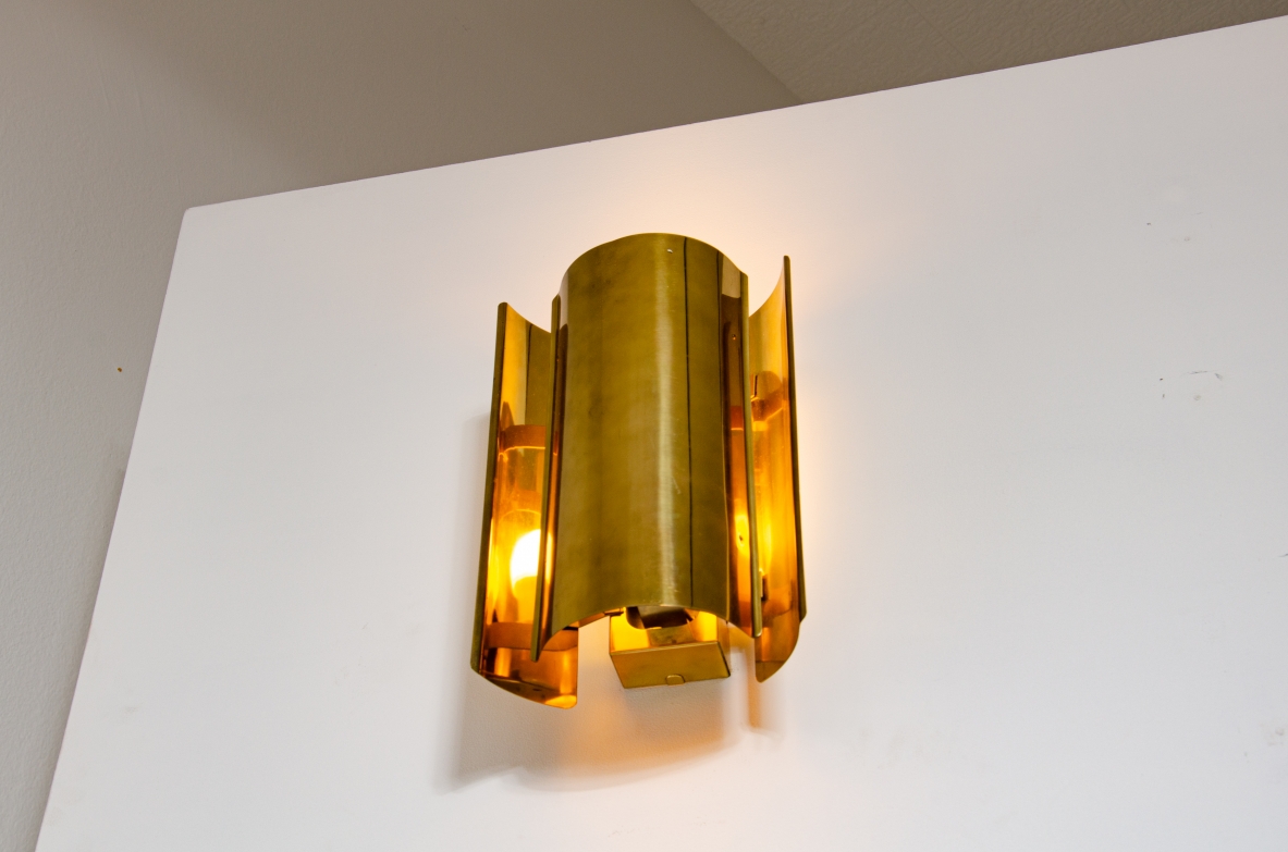 Pair of sconce wall lights in curved brass.  Prod. Falkenbergs, Sweden 1960's.
