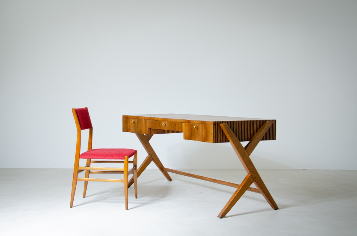 Oak desk with three drawers with ribbed wood band and curved top supported by double Y legs.  Turin School, Italy, 1950's.