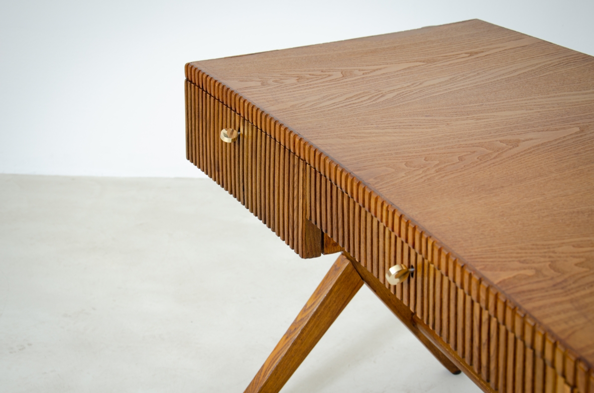 Oak desk with three drawers with ribbed wood band and curved top supported by double Y legs.  Turin School, Italy, 1950's.
