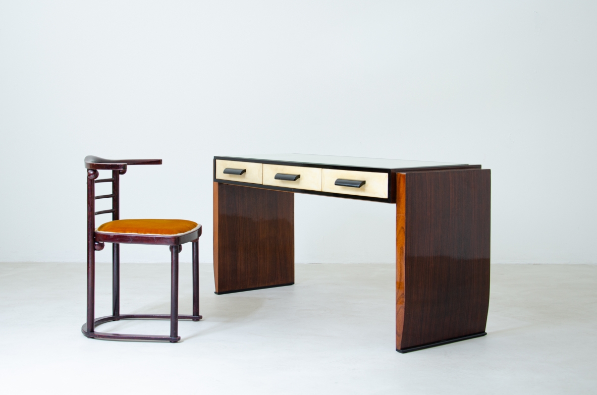 Splendid rosewood console table with three drawers covered in parchment and top in ground mirror.  Italian manufacture, 1930's.