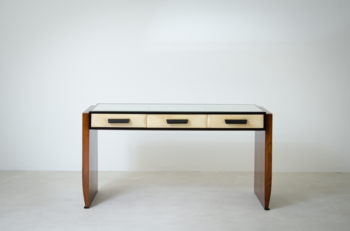 Splendid rosewood console table with three drawers covered in parchment and top in ground mirror.  Italian manufacture, 1930's.