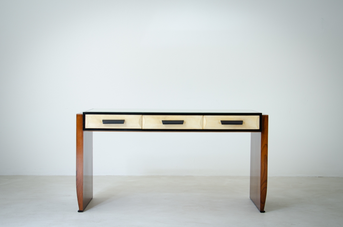 Splendid rosewood console table with three drawers covered in parchment and top in ground mirror.  Italian manufacture, 1930's.