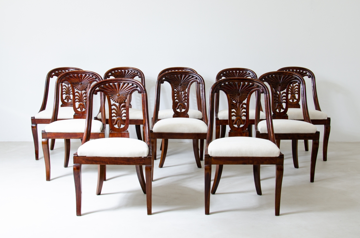 Rare set of 12 antique walnut cockpit chairs in walnut with carved back.  Charles X period,  Northern Italy, around 1830s.