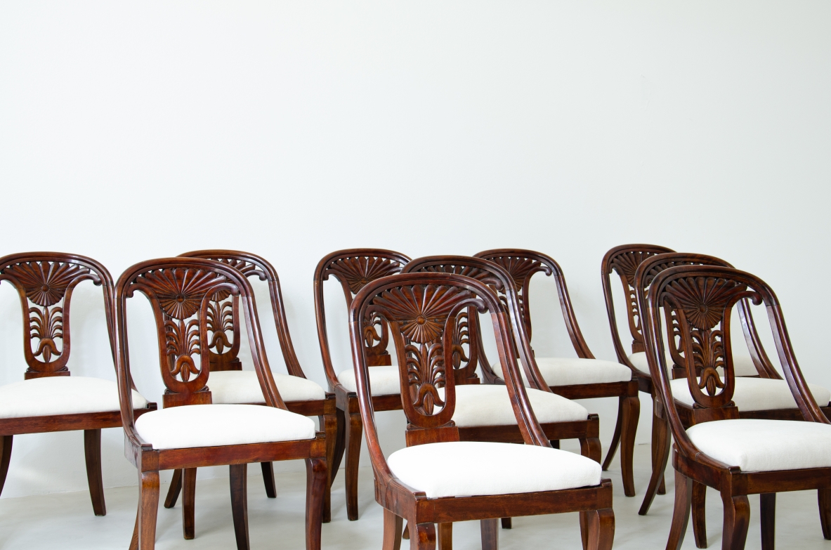Rare set of 12 antique walnut cockpit chairs in walnut with carved back.  Charles X period,  Northern Italy, around 1830s.