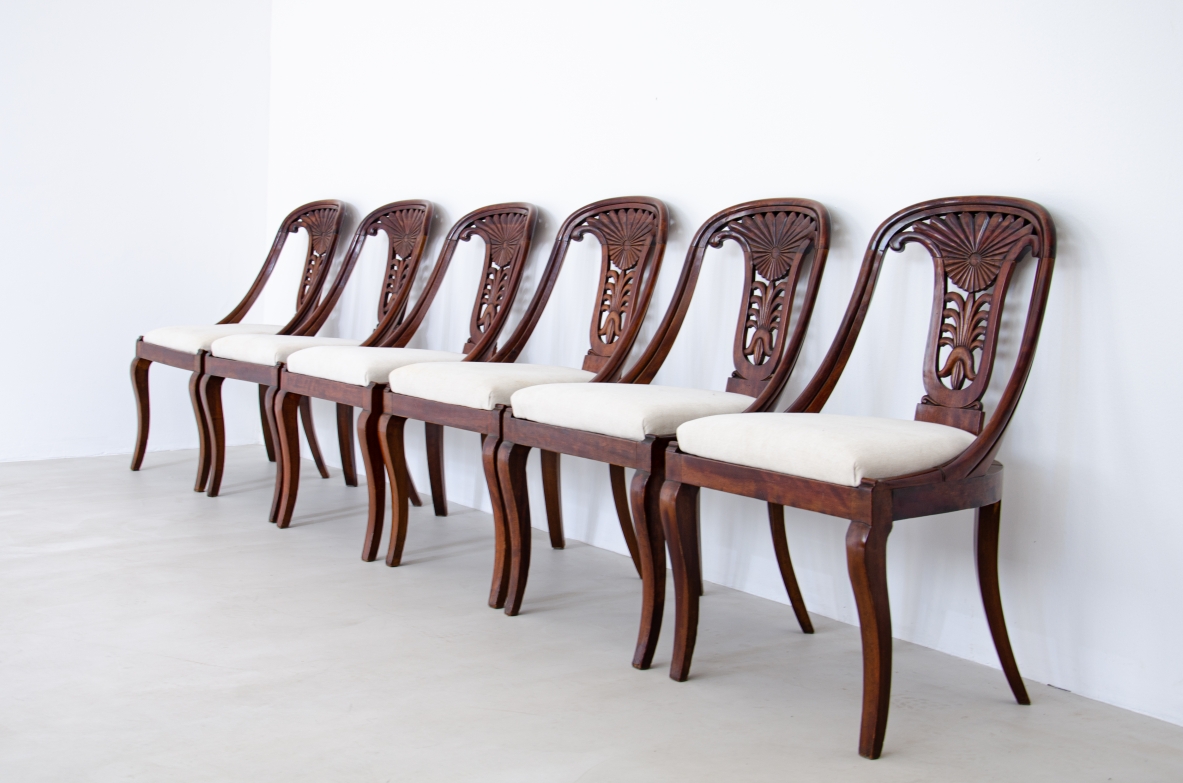 Rare set of 12 antique walnut cockpit chairs in walnut with carved back.  Charles X period,  Northern Italy, around 1830s.